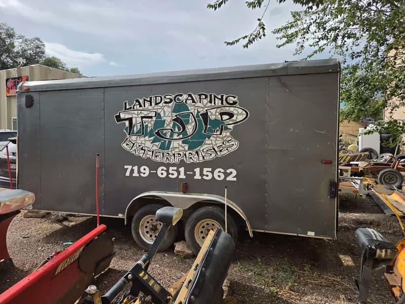 Enclosed Cargo Trailer w/ Dual Axles & Hitch, close-up view