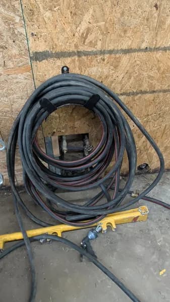 50 Ft Garden hose with nozzle. , side view