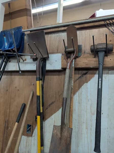 Lot of Landscaping Hand Tools with Wall Mount, detail view