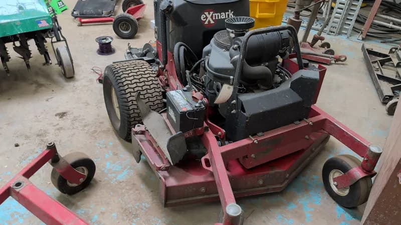 eXmark Zero Turn Radius Riding Lawn Mower w/ Bagger, side view