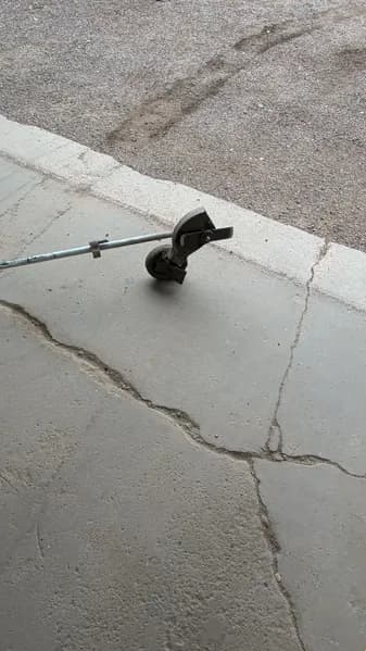 RedMax String Trimmer w/ Curved Shaft, side view