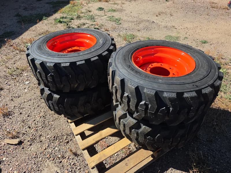 Set of 4 new wheels and tires for Bobcat/Kubota 12-16.5 N.H.S. SKS-1, primary view