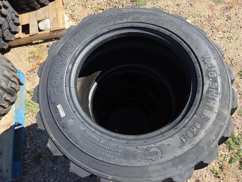 Set of 4 New Skid Steer Tires 10-16.5 SKS-1, side view