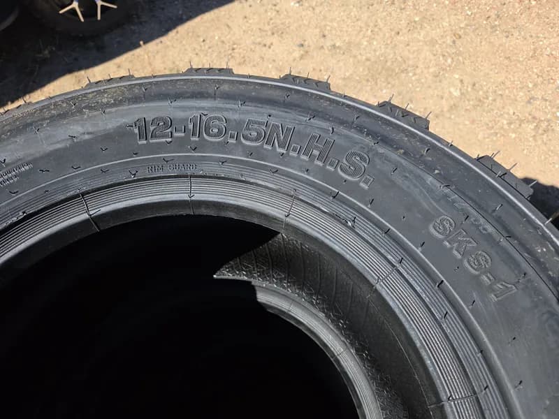 Set of 4 New Tires for Skid Steer 12-16.5 SKS-1, rear view