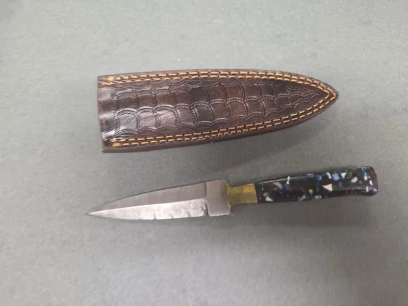 Fixed Blade Dagger Knife w/ Patterned Steel Blade, Resin Handle & Leather Sheath, side view