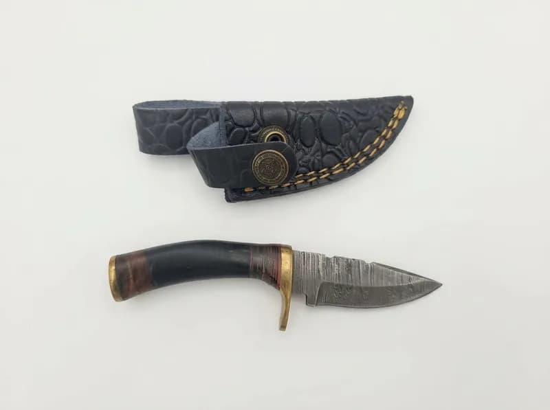 Fixed Blade Knife with Patterned Blade, Brass Guard and Leather Sheath, primary view