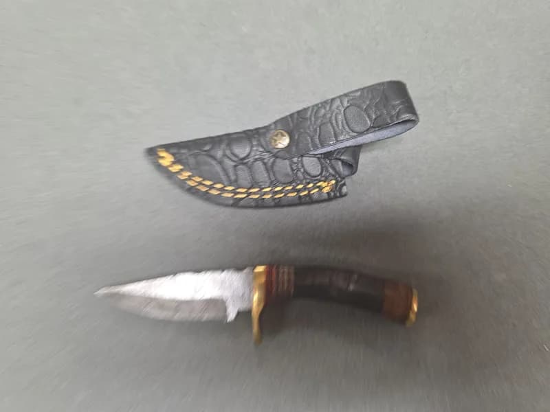 Fixed Blade Knife with Patterned Blade, Brass Guard and Leather Sheath, rear view