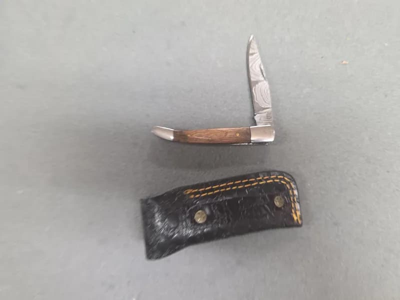 Folding Pocket Knife with Damascus-Pattern Blade, Wood Handle & Leather Sheath, rear view