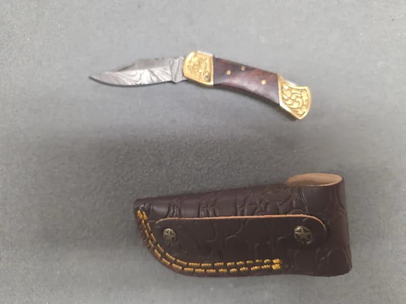 Pattern Welded Steel Folding Knife and Fixed Blade Knife w/ 2 Leather Sheaths, side view