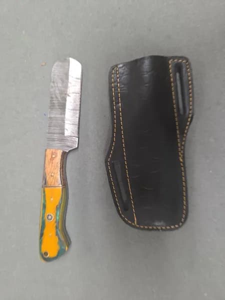 Pattern Welded Steel Folding Knife and Fixed Blade Knife w/ 2 Leather Sheaths, detail view