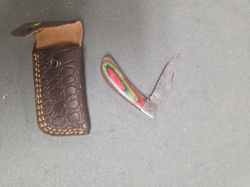 Folding Pocket Knife w/ Multicolor Laminated Wood Handle & Leather Sheath, side view