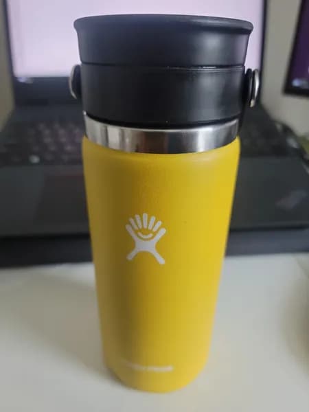 Hydro Flask Wide Mouth Flex Sip Lid Black with Yellow Insulated Bottle, close-up view