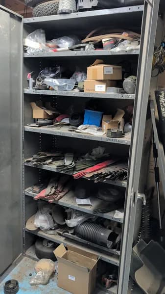 Lawn Equipment Parts & Accessories Lot with Metal Shelf - Cabinet not included, primary view