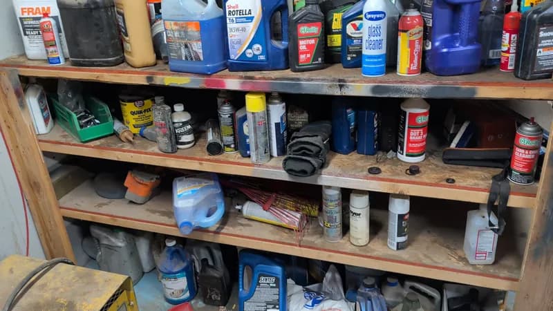 Large Lot of Automotive Fluids, Oils & Maintenance Products, close-up view