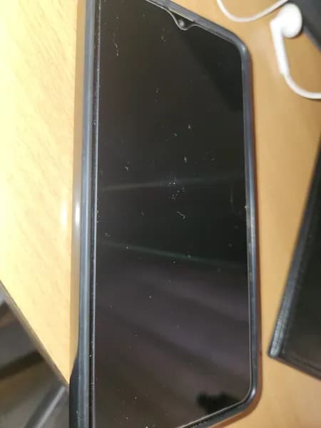Smartphone with Teardrop Notch Display in Black Case, primary view